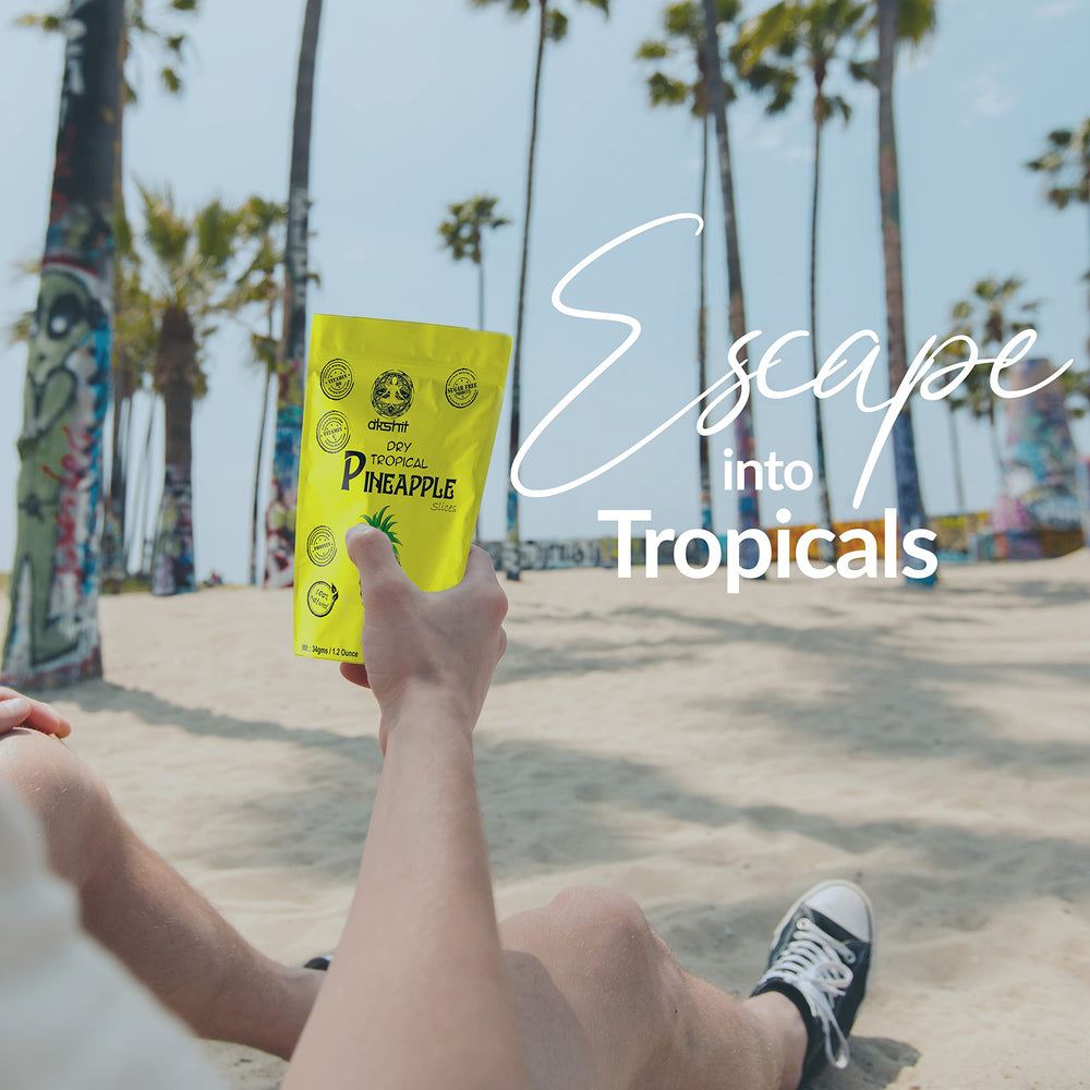 
                      
                        Man holding a packet of dried pineapple slices while having a great day
                      
                    